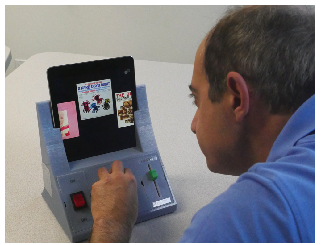 Figure 1: AMI, a reconfigurable tangible music player. By reconfiguring modules in the base, the player can be customized to a user’s specific needs.