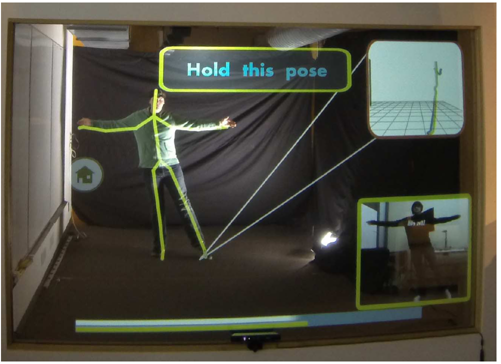 Figure 1: YouMove allows users to record and learn physical movement sequences. An augmented reality mirror provides graphic overlays for guidance and feedback. Note that for this photo the virtual vi